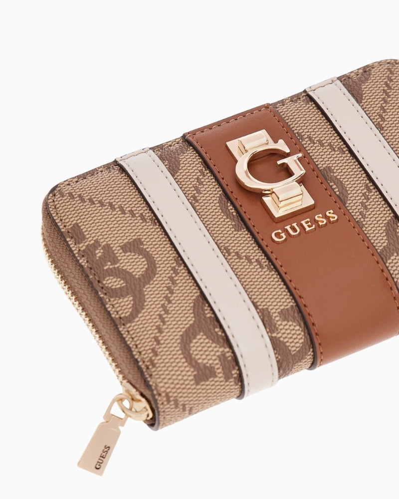 Beige faux leather wallet styled with matching GUESS handbag