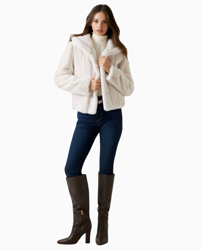 Model view showing long sleeves and plush striped faux fur fabric