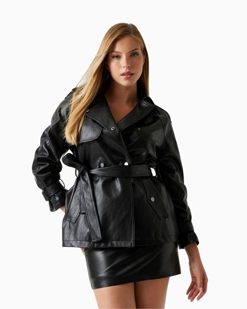 Front view of GUESS faux leather trench coat in black with sash belt and snap closure