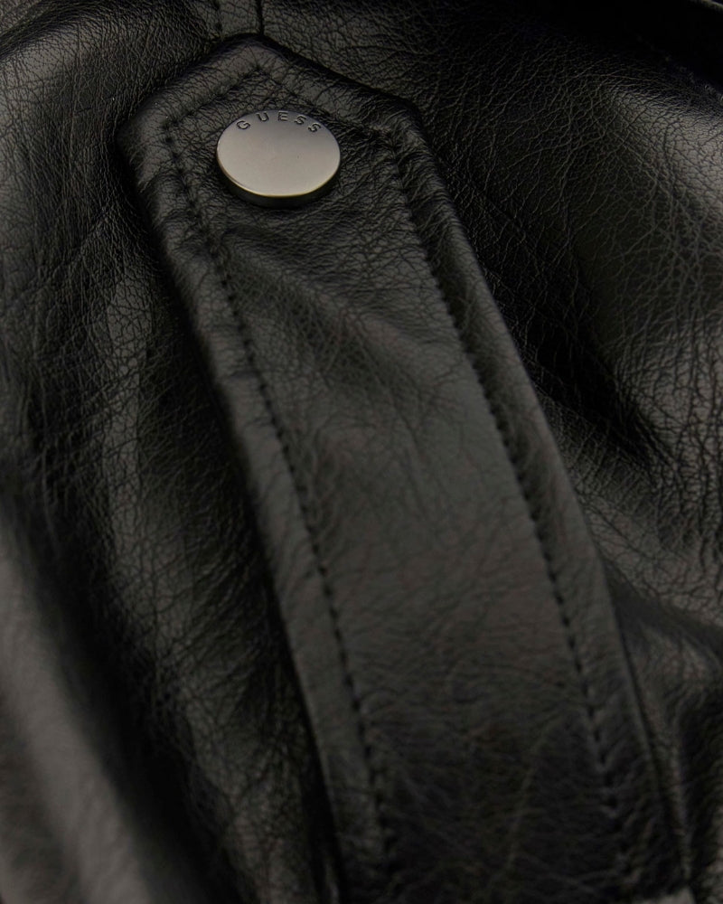 Close-up of snap flap pocket and matte faux leather texture on GUESS trench coat