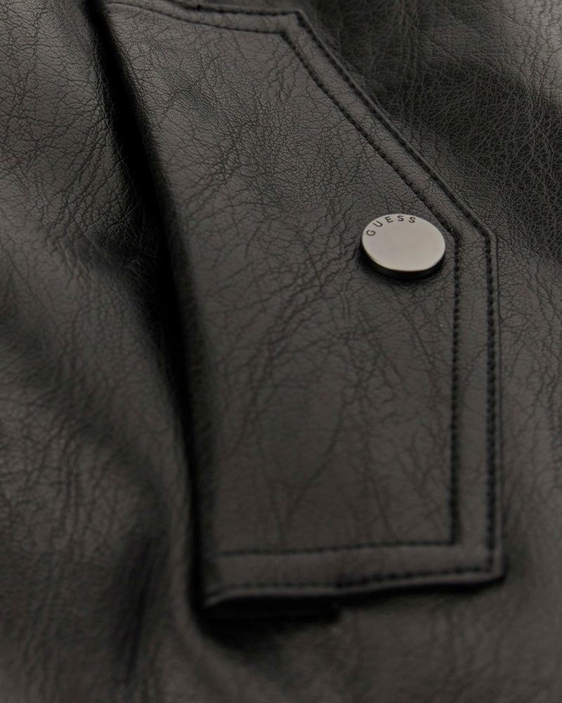 Close-up of snap flap pocket and matte faux leather texture on GUESS trench coat