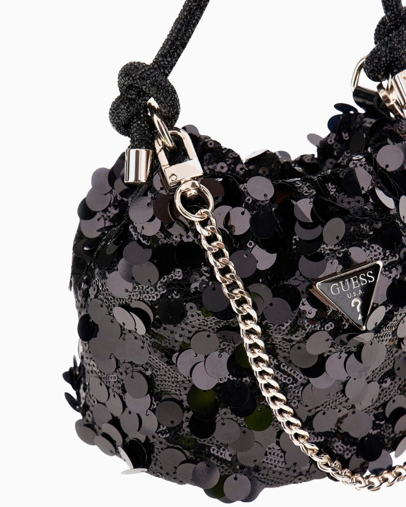 Side view of Holiday Shine bag showing rhinestone handle and compact size