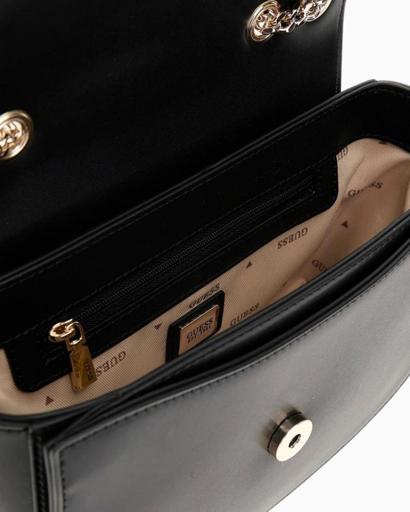 Interior of black Guess bag with zip pocket and signature logo lining