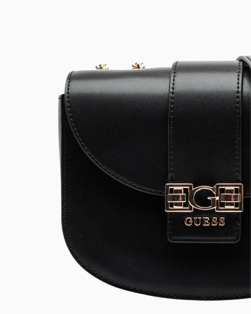 Front view of eco leather Guess handbag with embossed logo and button fastening