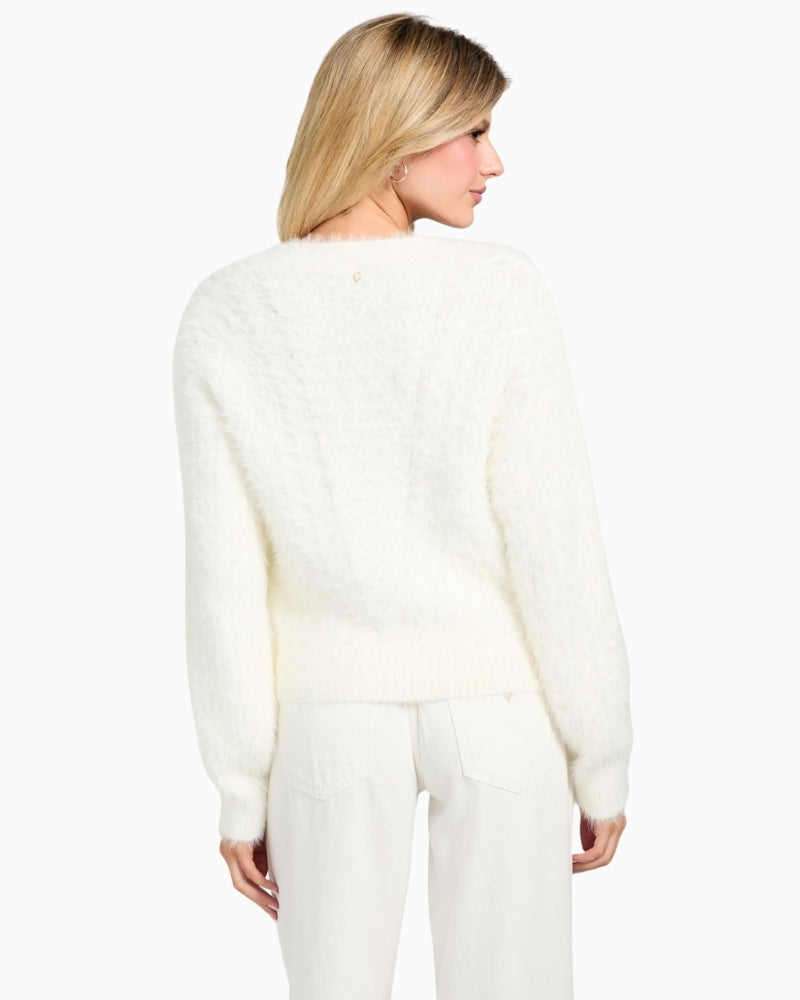 Back of GUESS women’s knit cardigan styled with jeans for a cosy everyday look