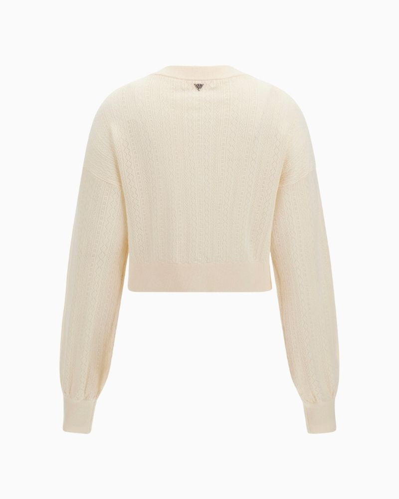 Back of Cream cardi styled with trousers for a relaxed smart look