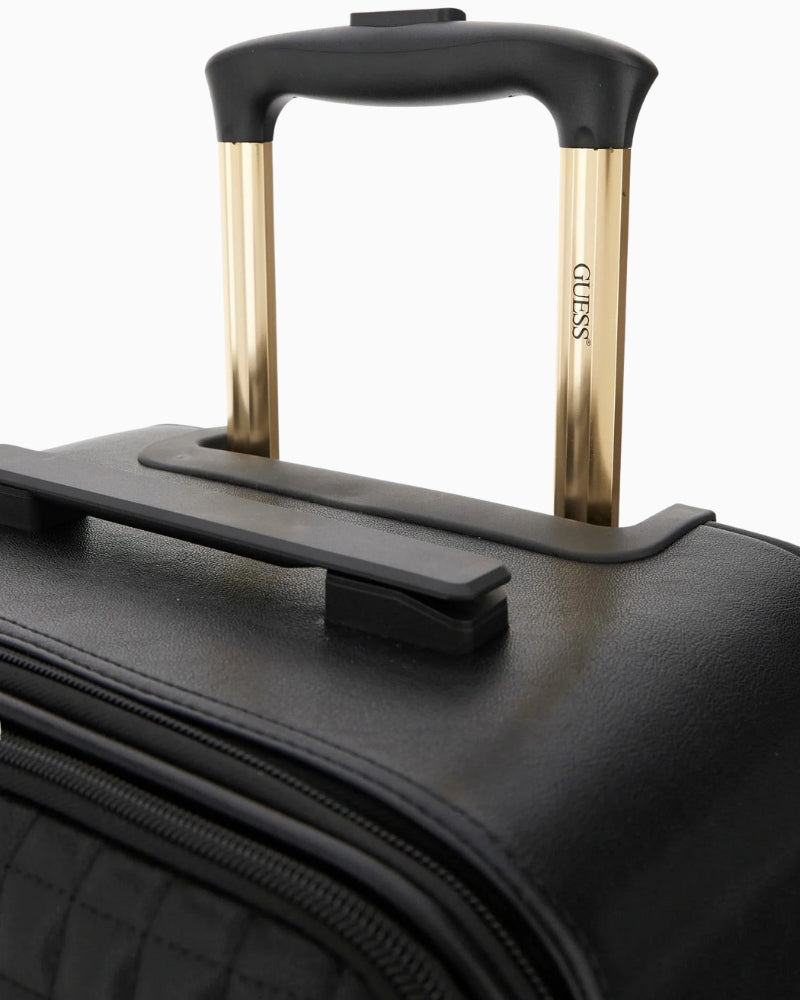 Close-up of logo detail on black Nadira travel luggage