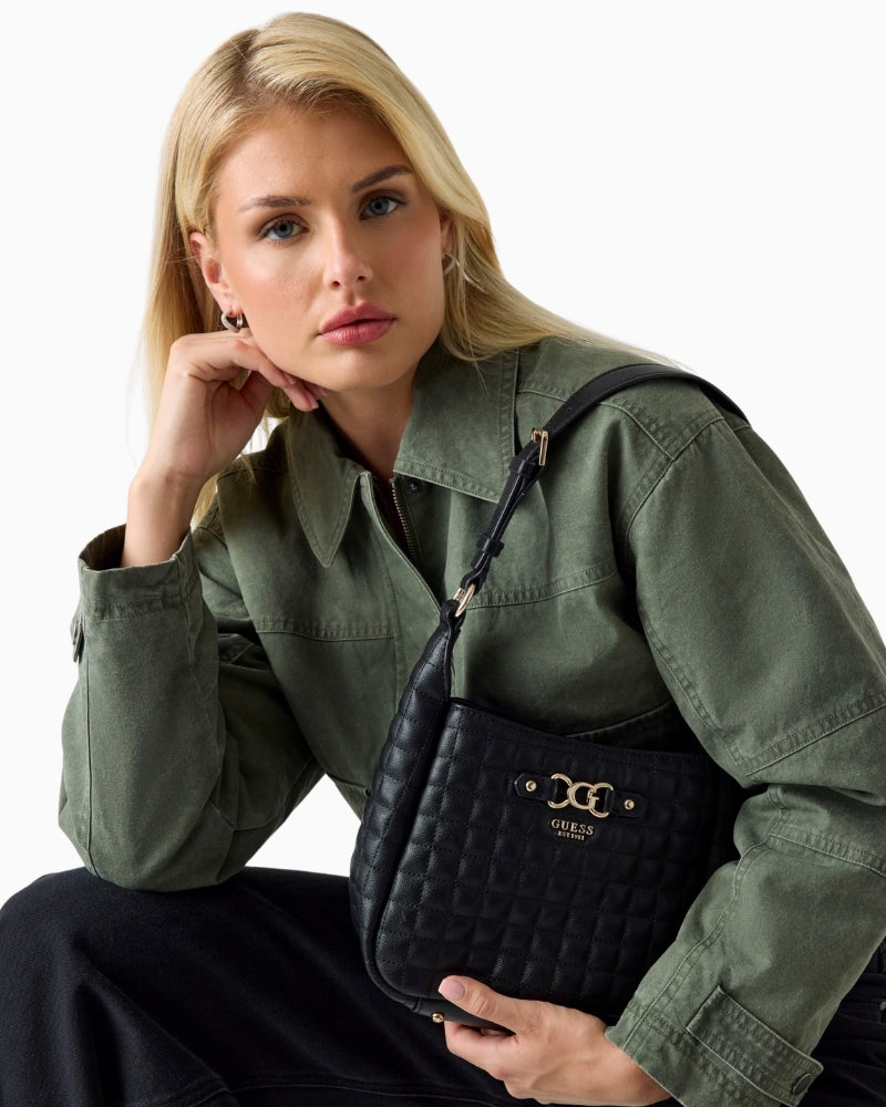 Front view of Nadira shoulder bag with button closure and quilting detail