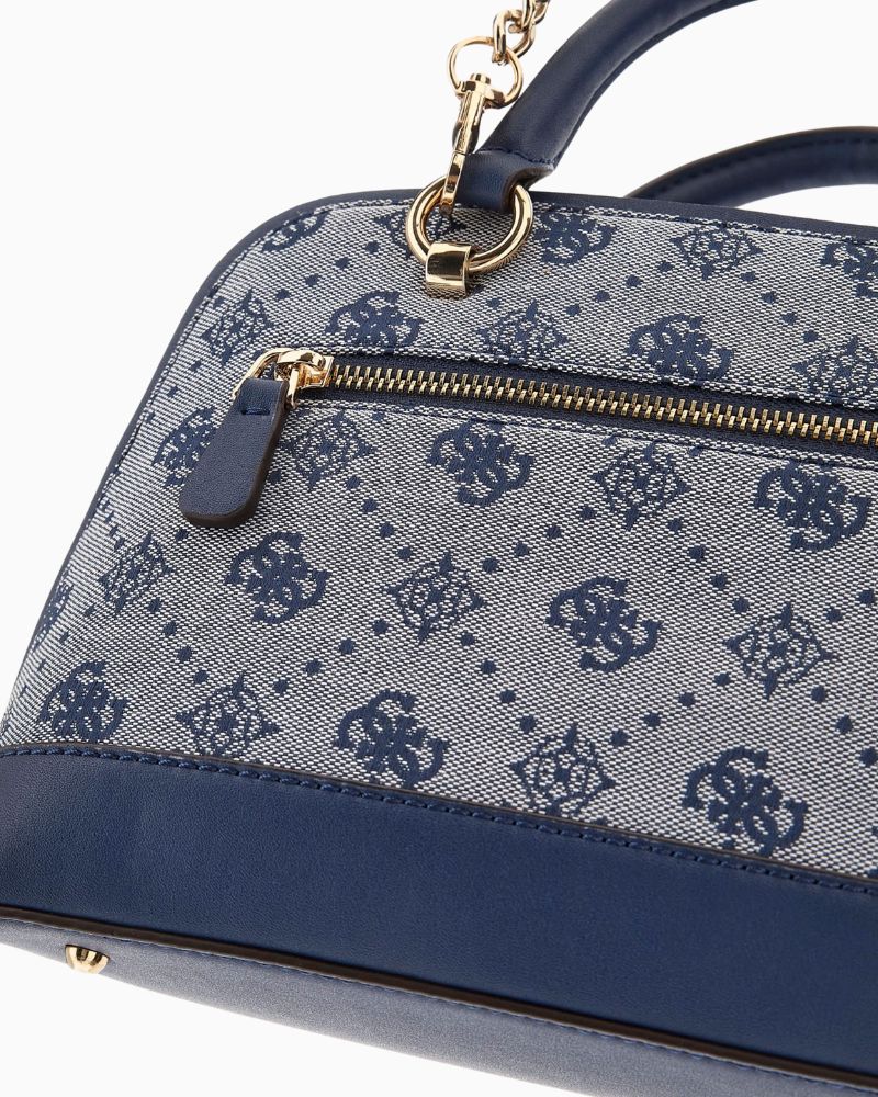 Close up of view showing detachable chain strap and structured silhouette