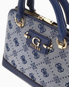 Side view showing detachable chain strap and structured silhouette