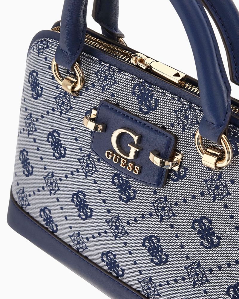 Side view showing detachable chain strap and structured silhouette