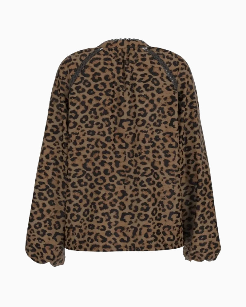 Guess top styled with black trousers for evening wear