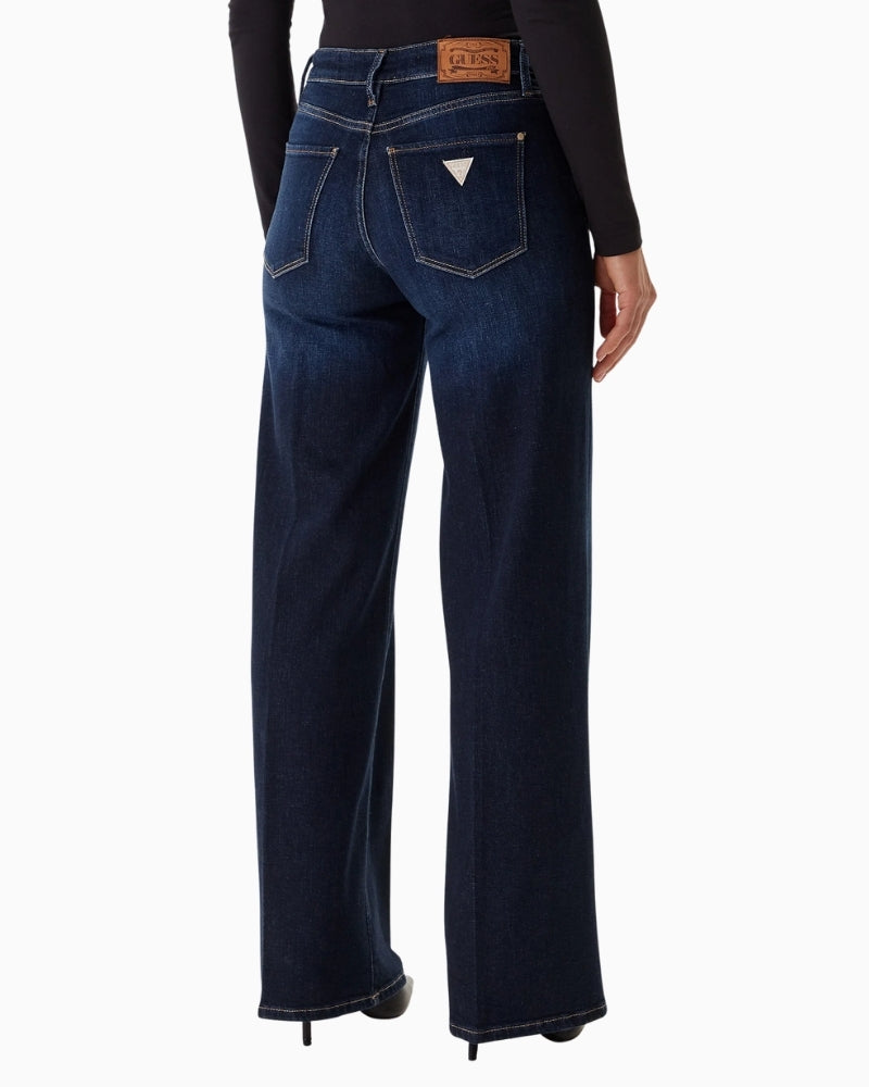 Back view of long tapered trousers with mid-rise waist and zip fastening