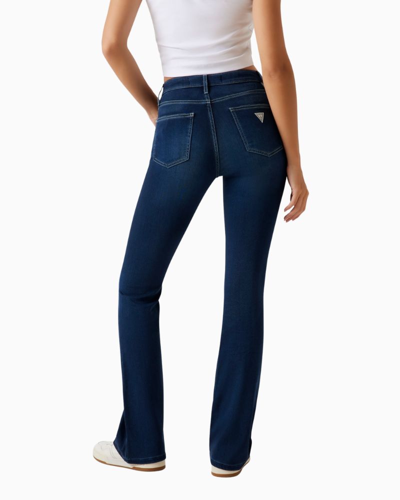 Back view of GUESS flare jeans showing fitted shape and classic pockets