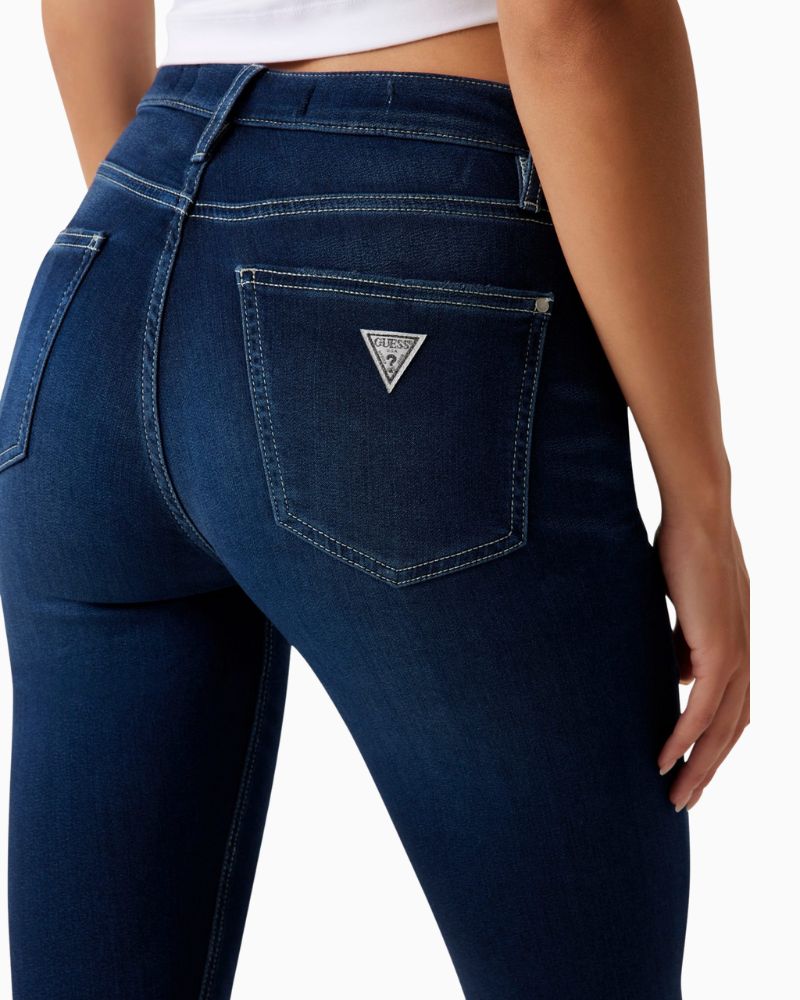 Back view of GUESS flare jeans showing fitted shape and classic pockets