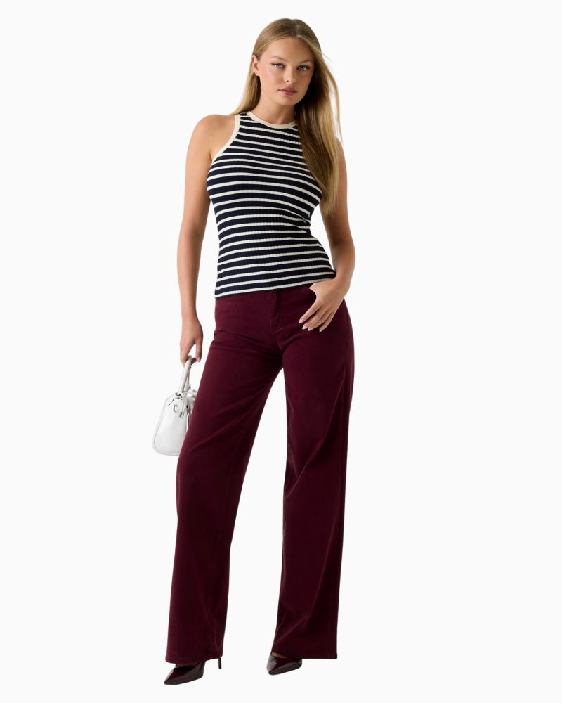 Guess burgundy palazzo jeans laid flat highlighting fabric texture and full leg flare