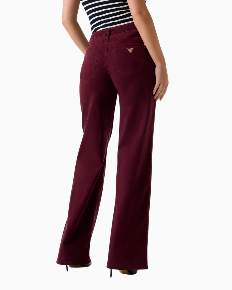 Back view showing drape and flow of burgundy wide‑leg Guess jeans