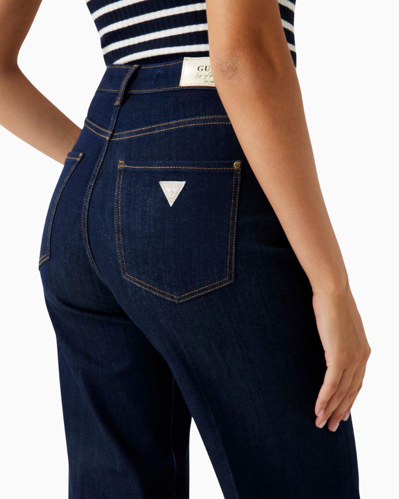 Close up of Dark blue wide leg jeans by GUESS with high waist and relaxed fit