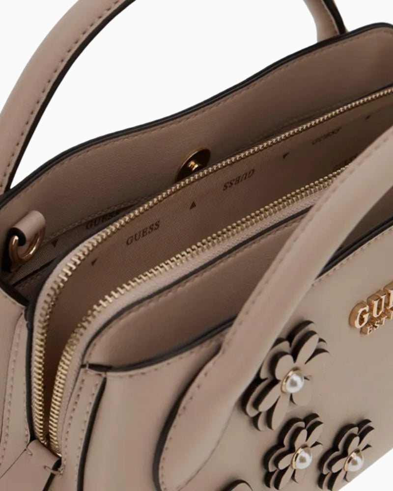 Interior of Guess Zaria bag showing three compartments and printed lining