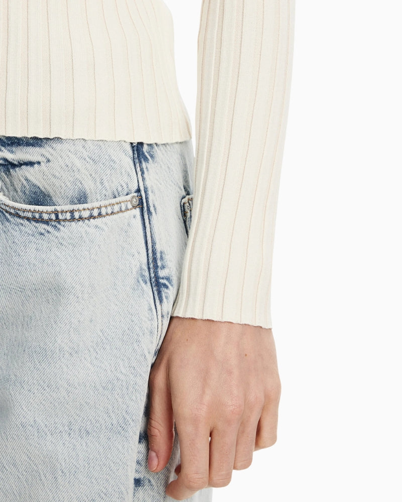 Close-up view of cardigan sleeve showing oft texture