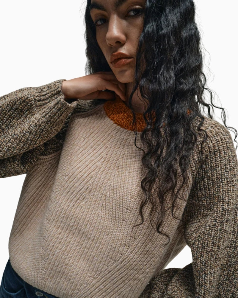 Close-up of textured melange wool fabric in relaxed knit