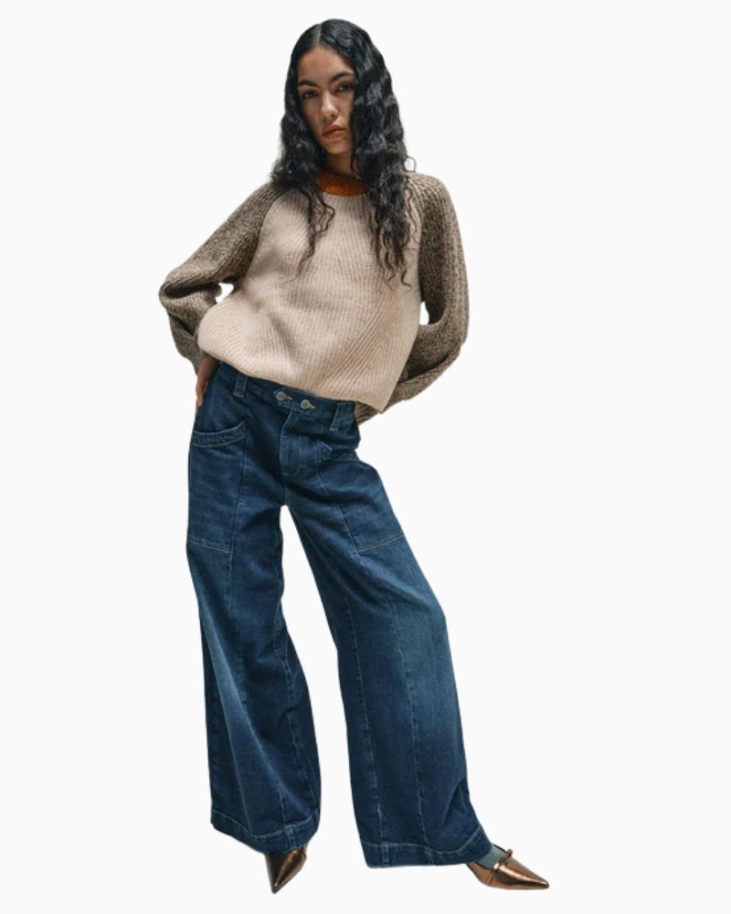 Front view of mid-rise jeans with double-button waist and large pockets