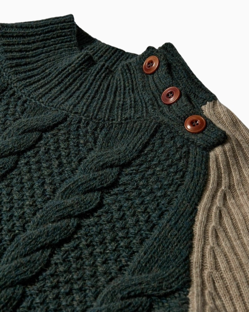 Close-up of Heyanno jumper showing cable knit pattern and ribbed trims