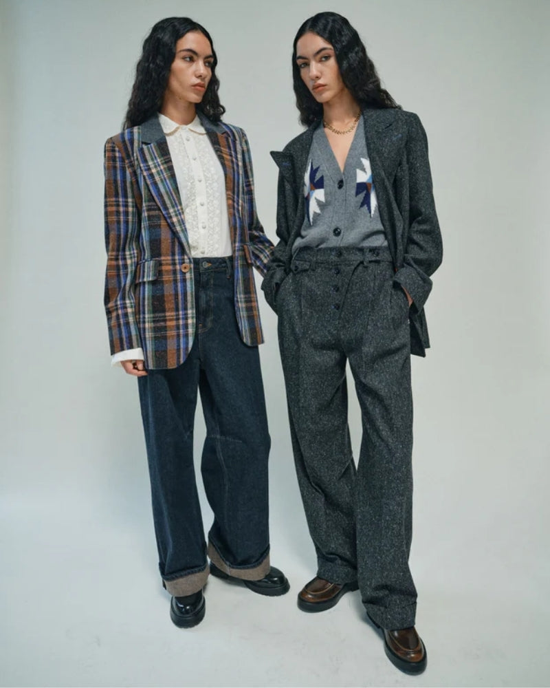 Styled knit vest layered over a shirt with relaxed fit