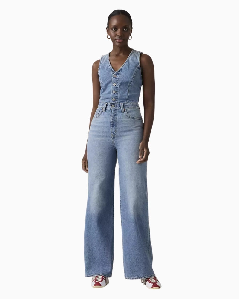 Levi’s denim wide-leg jumpsuit, front view showing slim fit and button front – Áines Boutique
