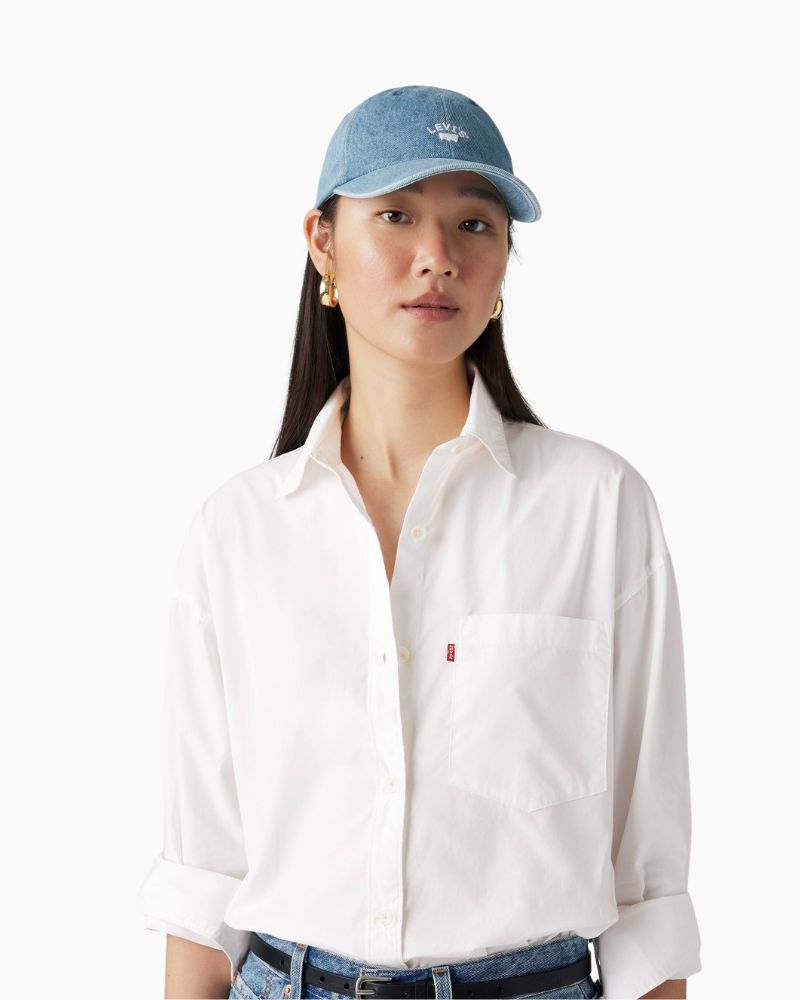 Levi’s Lazy Girl Cap in off-white cotton with curved brim and playful logo design