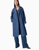 Model view of Levi’s trench showing standard fit and casual buttoned style