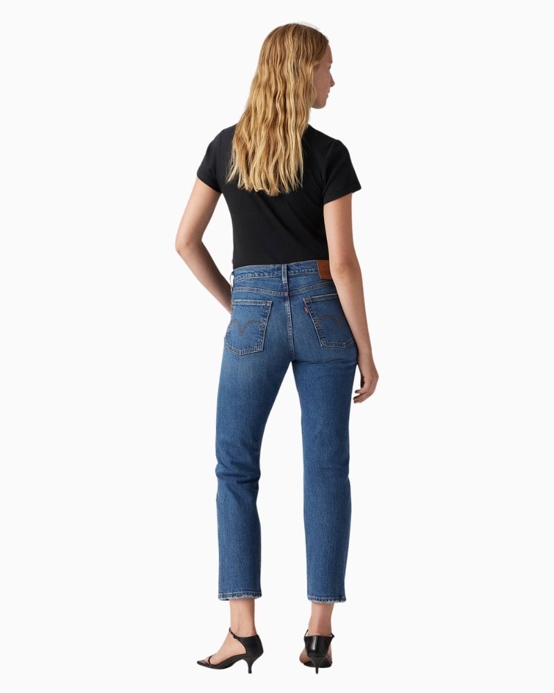 Back view of Levi’s Wedgie jeans showing snug fit through hip and vintage-style distressing