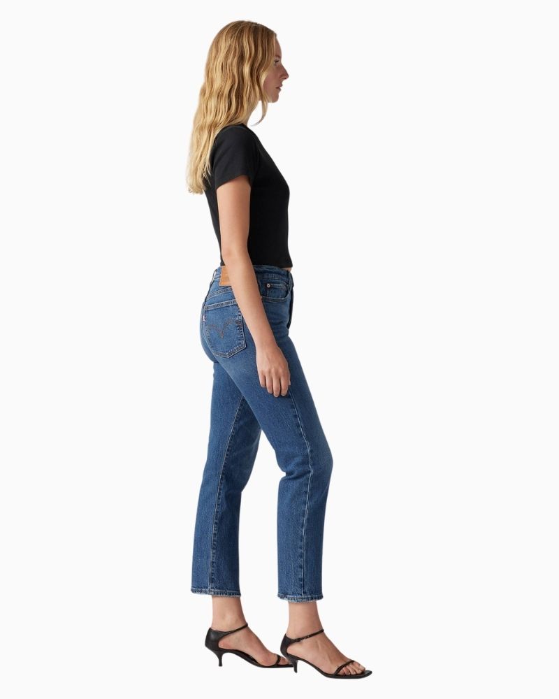 Side view of Levi’s Wedgie jeans showing snug fit through hip and vintage-style distressing