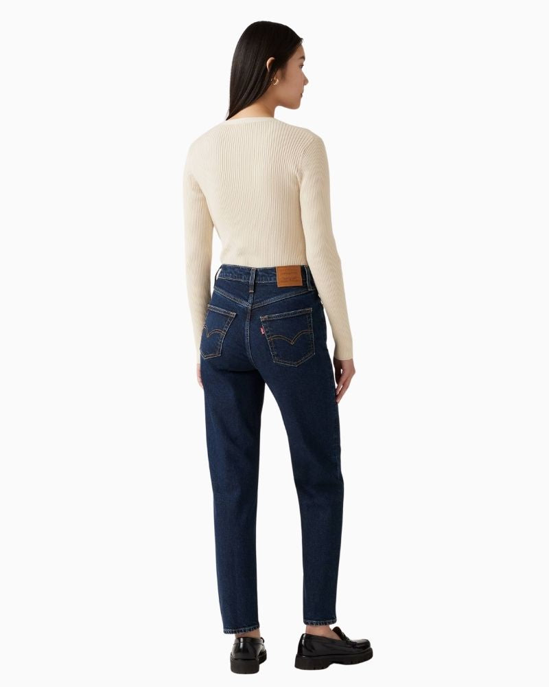 Back view of Levi’s vintage-fit mom jeans showing relaxed hip and tailored ankle shape