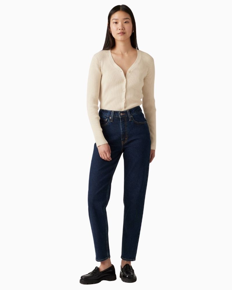 Model view of Levi’s vintage-fit mom jeans showing relaxed hip and tailored ankle shape
