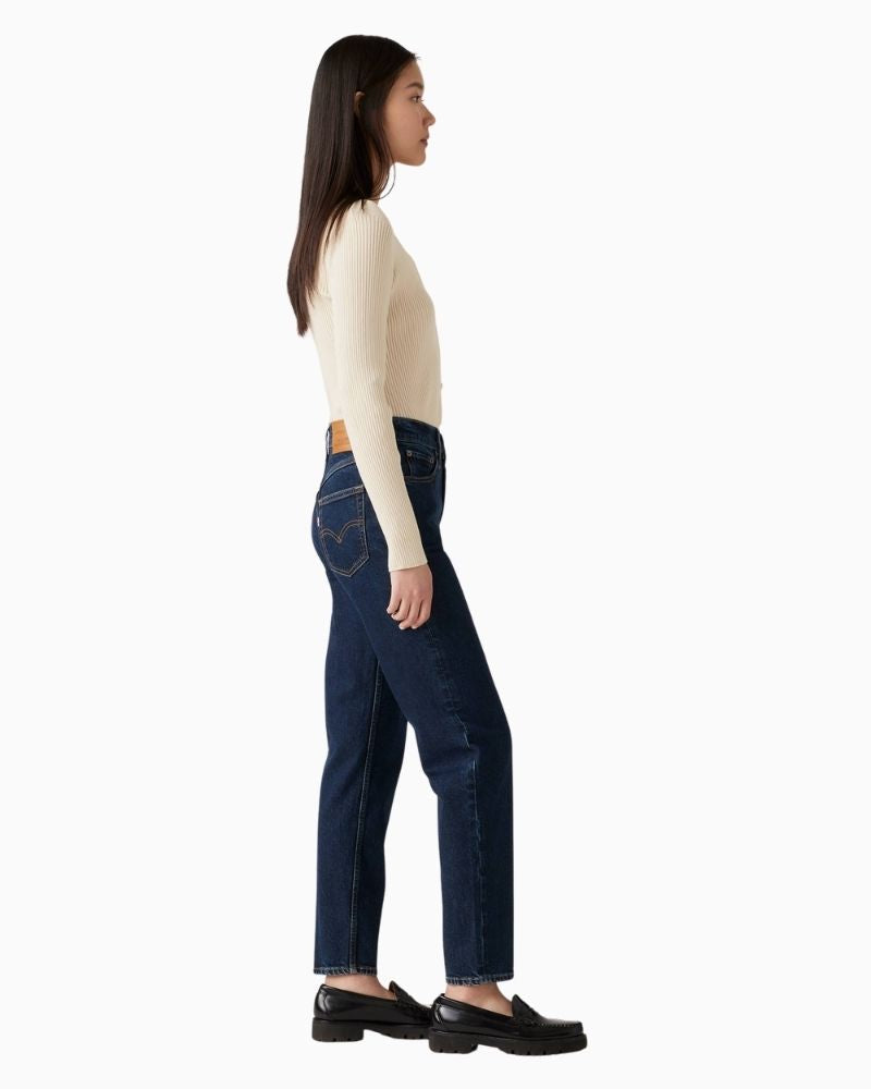 Side view of Levi’s vintage-fit mom jeans showing relaxed hip and tailored ankle shape