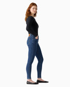 Side angle showing slim fit through thigh and ankle on Levi’s 721 jeans