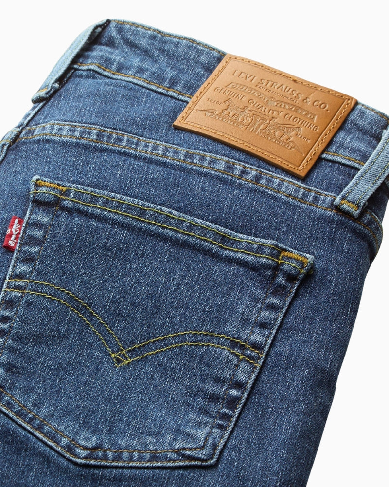 Close-up of Levi’s Stellar Stretch denim texture and zip fly closure