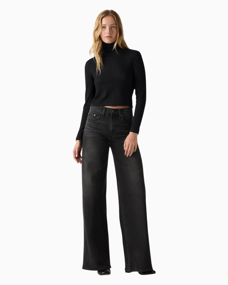 Front view of Levi’s 728 wide-leg jeans in high-rise fit and classic blue wash