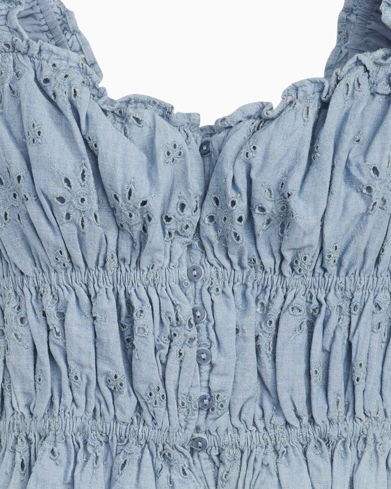 Close up of Levi’s Amaya cropped blouse in light blue chambray with ruching