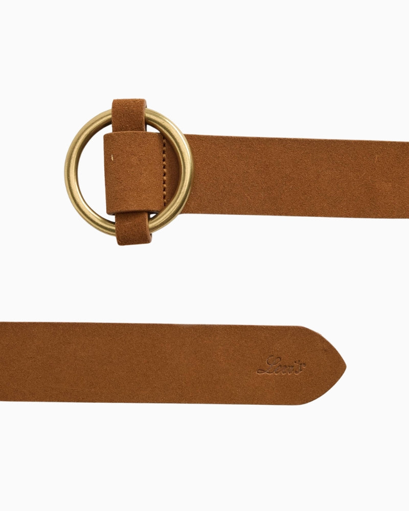Close-up of round metal buckle and smooth leather texture on Levi’s belt