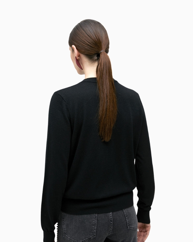 Back of Black merino blend knit sweater by Lola Casademunt with jewel embellishment