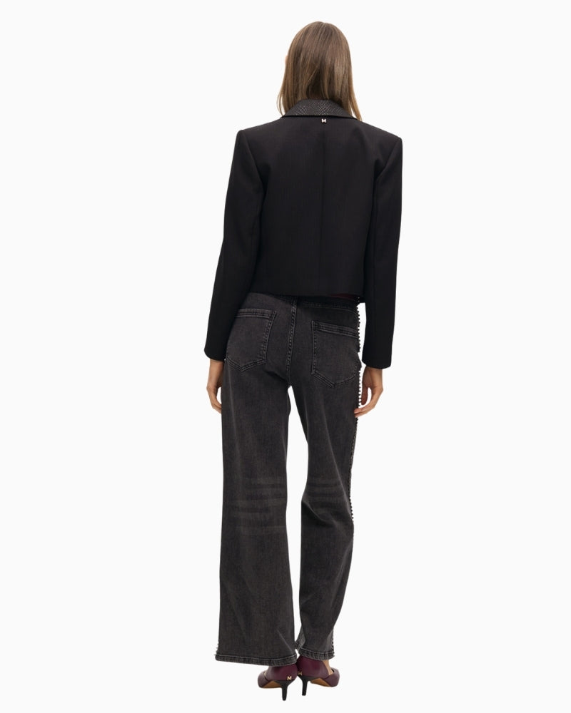 Back view of blazer showing printed collar and decorative button detail