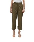 Model wearing Lola Casademunt olive green poplin trousers with cropped turn-up hems