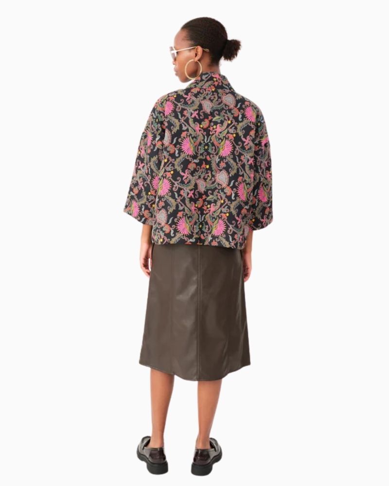 Back view of lightweight cotton jacket in pink, orange and green pattern