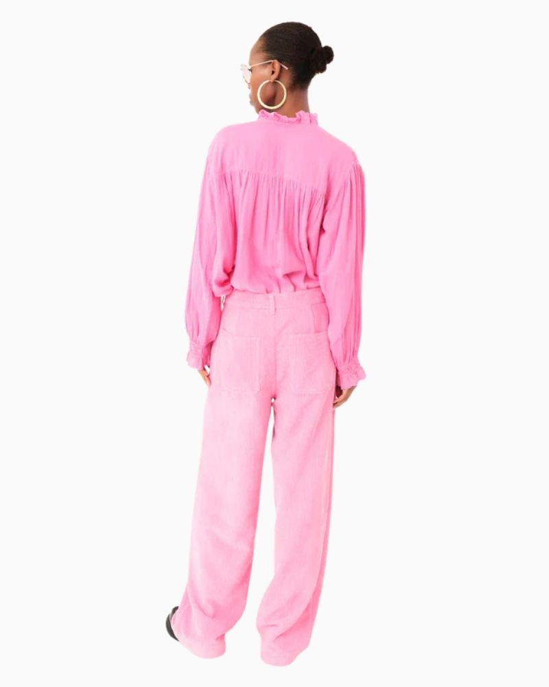 Back of pink blouse showing ruffled cuffs and broderie anglaise detail