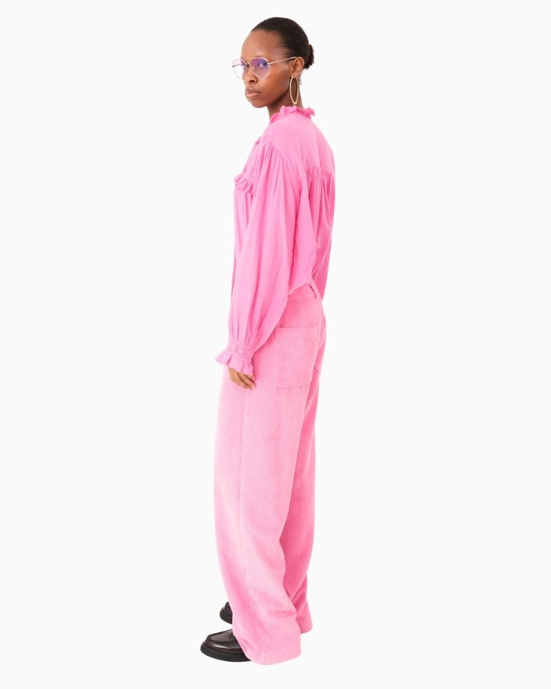 Side of pink blouse showing ruffled cuffs and broderie anglaise detail