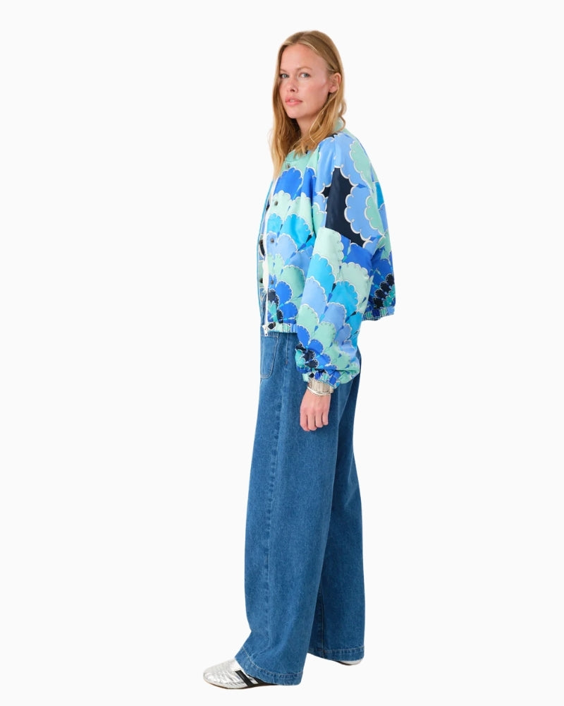 Side view of blue patterned transitional jacket with side pocket detail