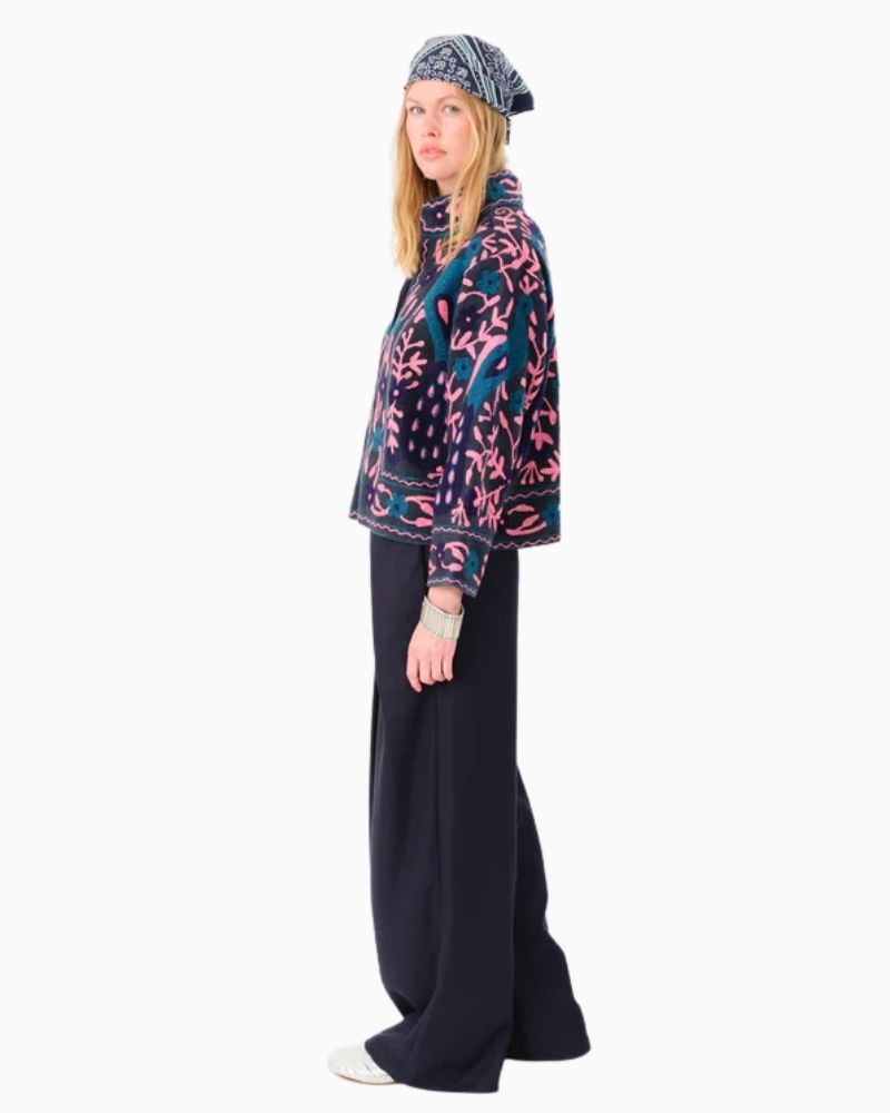 Side view of embroidered cotton jacket showing floral detail and relaxed fit