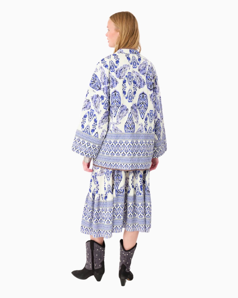 Back view of quilted transitional jacket with long sleeves